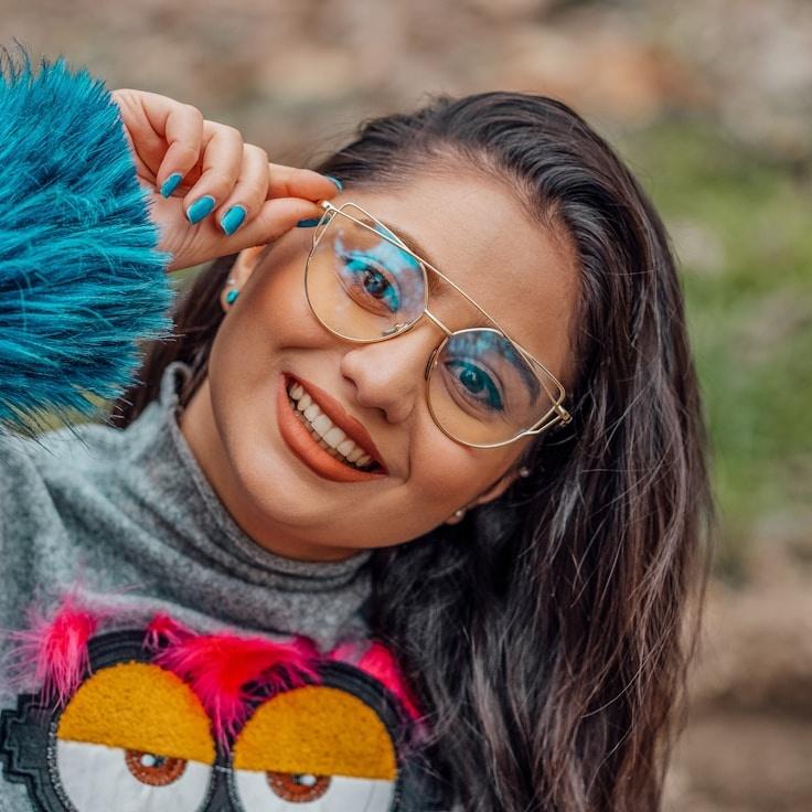 Avery Singh, Lead Design Curator at SignalMeadowRift, reviewing corporate floral arrangements